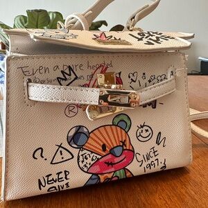 Designer Cream Handbag with Artistic Print